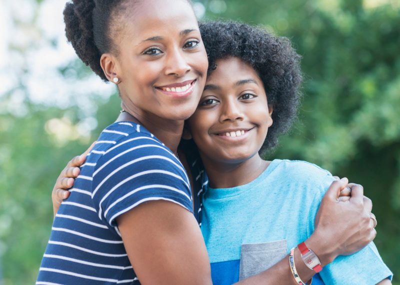 Mother Hugging Autistic Child