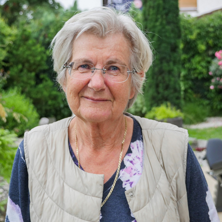 older woman smiling at the camera